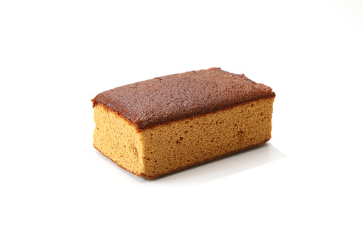 Pictured brown sugar japanese sponge cake in a white background.