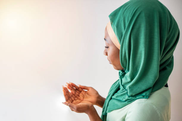 istock Arab Muslim woman praying 1212242788