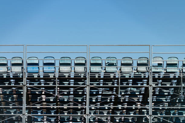 Aerial view of a modern, multi-tiered blue sports stadium with capacity for large events a