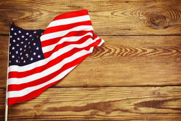 istock American flag on wooden background 1212245209