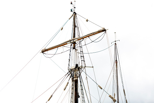 Classic sailing tall ship mast, white background with copy space, full frame horizontal composition