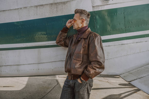 istock Young man is touching his sunglasses outdoors 1212250003
