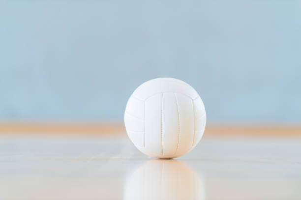 istock A volleyball and reflection on a wooden floor 1212256656