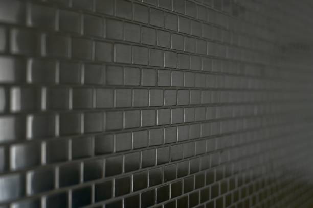 istock Metal mosaic background with a moving perspective of small bricks. 1212258352