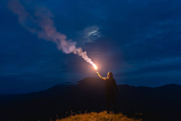 istock The man with a firework stick standing on a mountain 1212259221