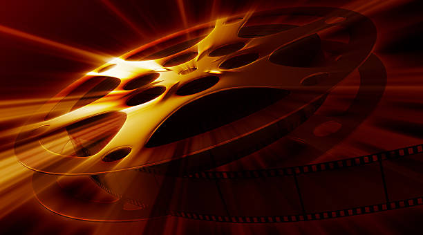 Shining film reel on the dark background. XXXL size  film premiere stock pictures, royalty-free photos & images