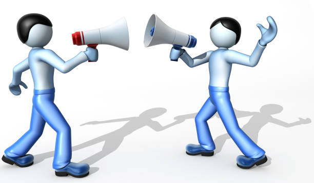 istock Duel. Two men yell at each other megaphones 121226230