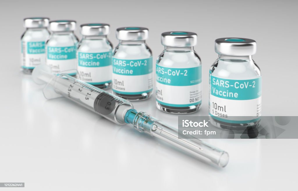 Syringe with Row of Vials of Coronavirus Vaccine on Shiny White Rendered Illustration of Coronavirus SASRS-CoV-2 vaccine (which is scheduled to become available in 2021). Syringe and several filled vials on bright shiny floor. Vaccination Stock Photo