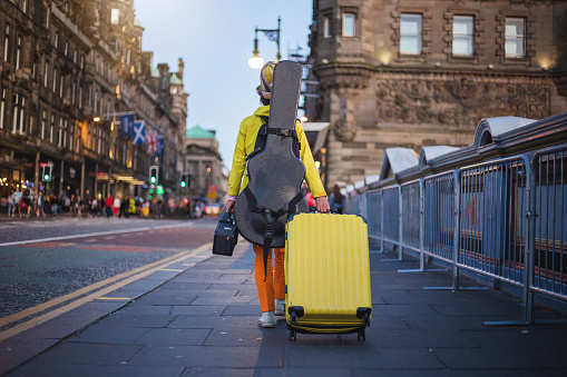 Tourist walking down a street in Scotland