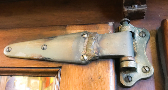 Picture of a cub board latch taken in a hundred year old building.