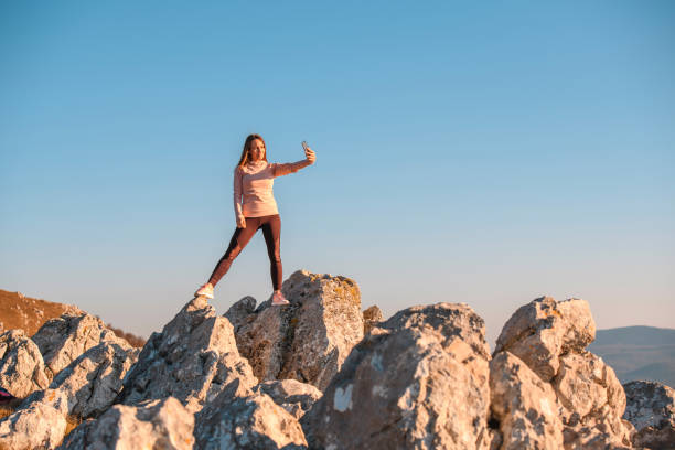 istock Woman taking a selfie on a mountain 1212268777