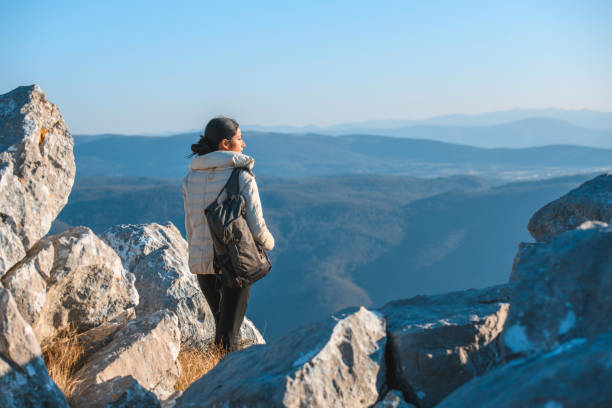 istock Indian woman standing on a mountain 1212268900