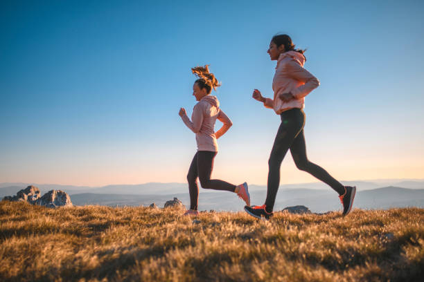 istock Women runing on a mountain 1212269066