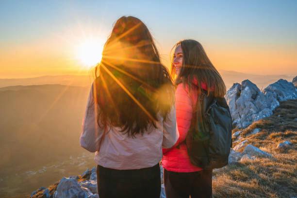 istock Sportswomen Looking at Sunset in the Mountains 1212270020