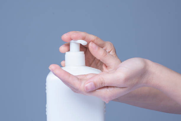 istock dult Woman Washing Hands with Liquid Soap 1212272845