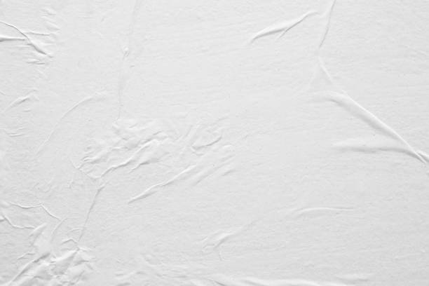istock Blank white crumpled and creased paper poster texture background 1212275815