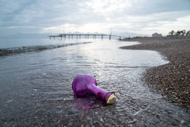 Plastic canister polluting a sunny beach
