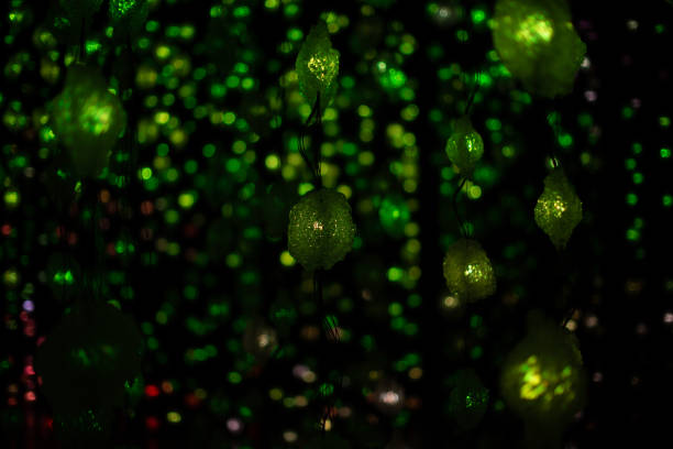 istock Abstract Christmas green garland lights on black background template 1212279392