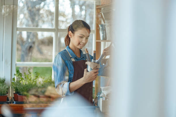 istock Serious young woman holding corked small bottles 1212279550