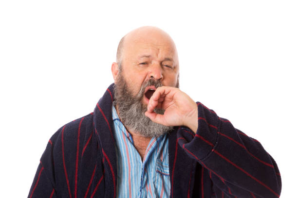 istock A Man in Pajamas Yawning 1212287885
