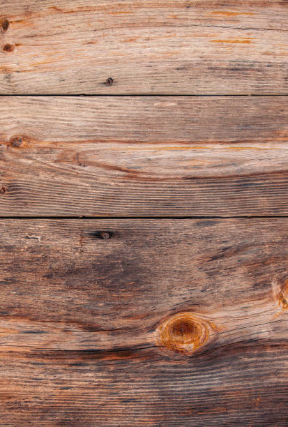 istock Grunge old brown wood door textured background 1212288743