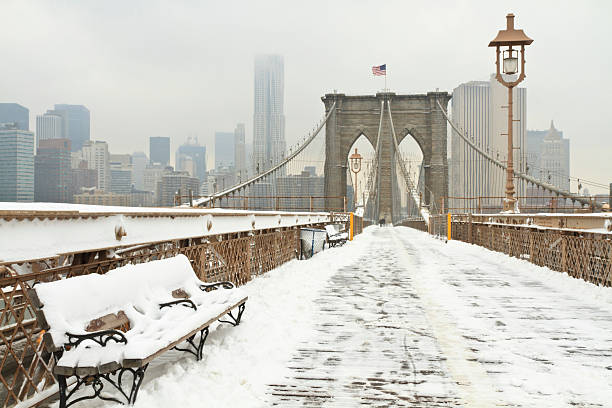 Brooklyn Bridge Snowy Bench stock photo
