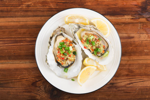 istock Barbecue overbaked fresh opened oyster with garlic, 1212294126