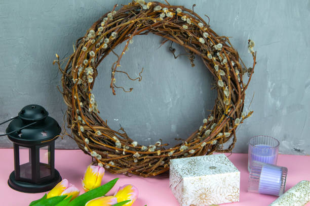 istock Easter wreath, yellow Easter eggs around tulips, gifts and wrapping paper 1212298509