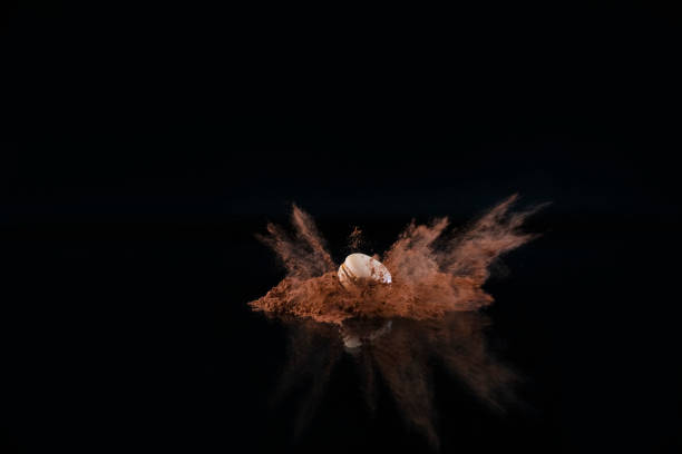 Explosion of cocoa powder with a macaron