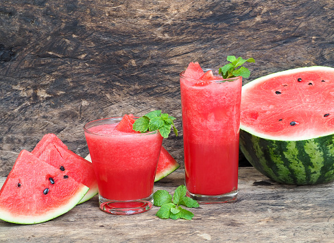 Watermelon Juice, Healthy watermelon smoothie and mint Mint leaf on a wooden background