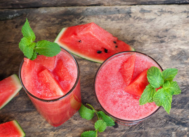 Top view watermelon Juice, Healthy watermelon smoothie and mint Mint leaf on a wooden background
