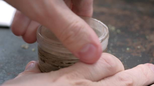 istock grinding marijuana in an old grinder on a rusty background 1212303799