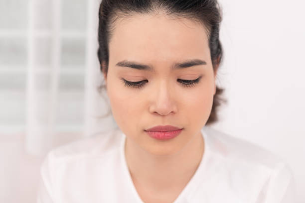 istock Young woman feel sick and unwell on bed 1212304028