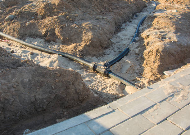 istock Plastic pipe for laying underground electrical cables for communication wires. 1212307987