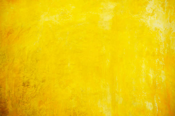 istock Abstract background from old yellow concrete wall with grunge and scratched. 1212308947