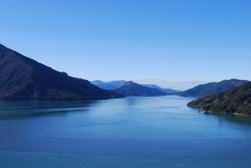 A view up the Kenepuru Sound, in the Marlborough Sounds, New Zealand. The focus is on the water at the front.