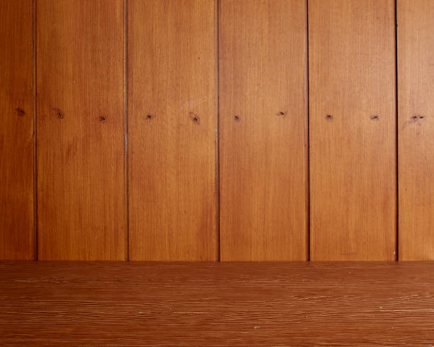 istock Empty wooden desk table, Old red dark wood wall texture 1212315697