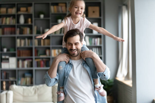 istock Smiling young dad have fun play with little daughter 1212315827