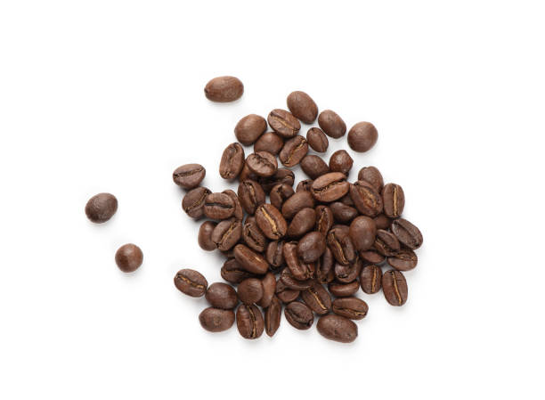 istock Heap of roasted coffee beans isolated on white. Top view. 1212319190