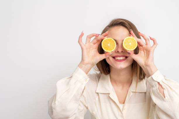 istock Oranges in hands of woman. 1212322272