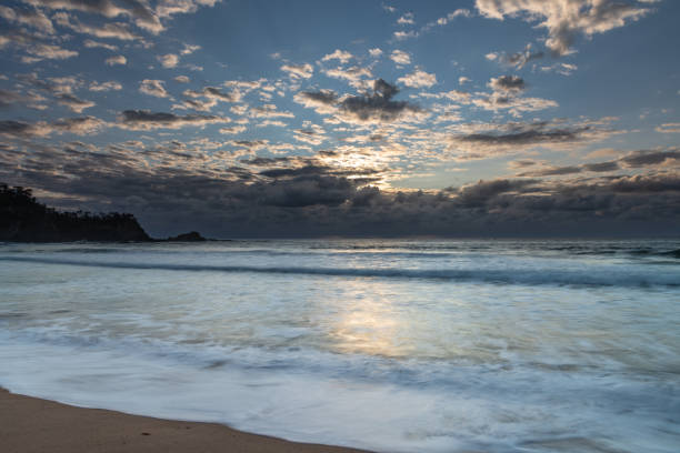 istock Clouds and Surf - Sunrise at Malua Bay 1212322332