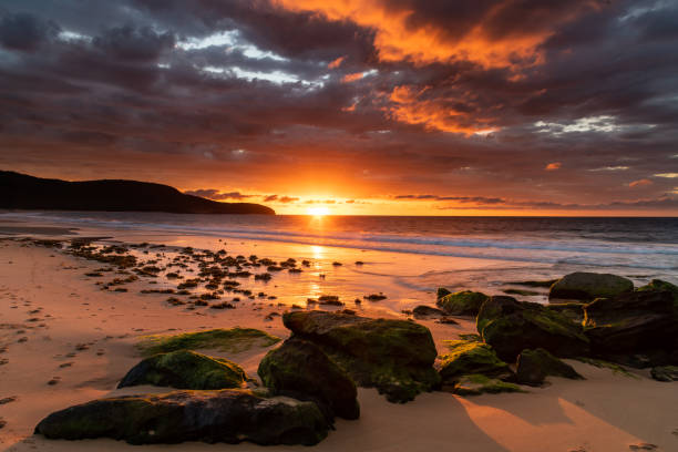 istock Cloudy Sunrise Colours Up at the Seaside 1212323068