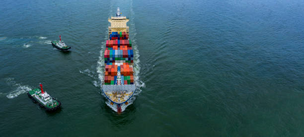 istock Aerial view container ship carrying container box in import export, Global business cargo freight shipping commercial trade logistic and transportation oversea worldwide  by container vessel in the open sea. 1212326381