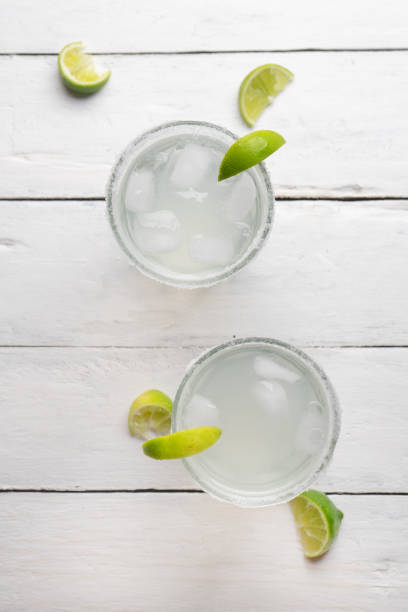 istock Mexican lime margarita cocktail on white background 1212326497