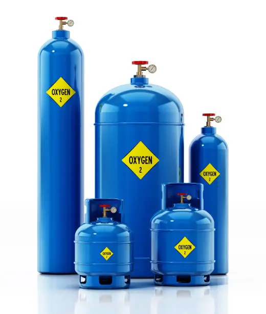 Photo of Various sized Oxygen tanks isolated on white