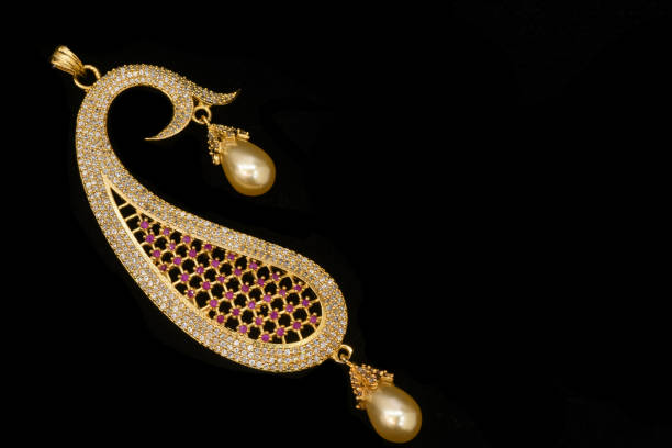 istock Fancy Designer Jewelry - Pendant closeup macro image on black background 1212329084