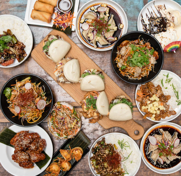 Table top view of Asian fusion food. Table top view of Asian fusion food on a table. fusion food stock pictures, royalty-free photos & images