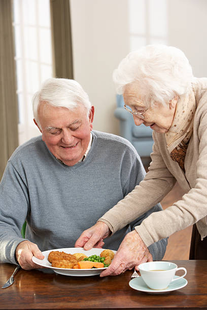 istock Senior Couple Enjoying Meal Together 121233130