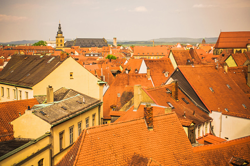 Roofs of houses in Bamberg city in bavaria. Ancient city in Germany. Medieval town. Travel around Europe. Roof tiles. Beautiful awesome summer landscape. Buildings and architecture in Bamberg.