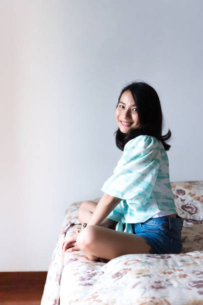 istock Woman on bed with happiness and joyful feeling 1212335013